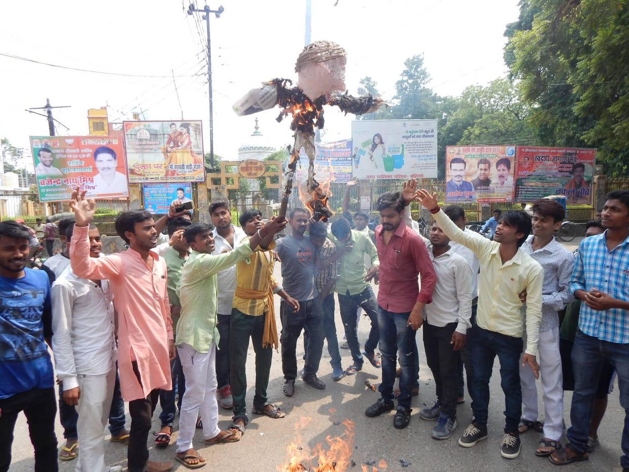 Students blow the effigies of XEN