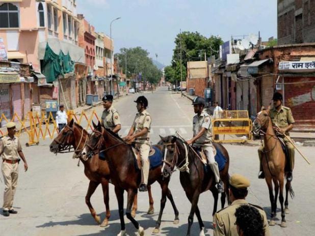 police review the curfew situation in old city jaipur