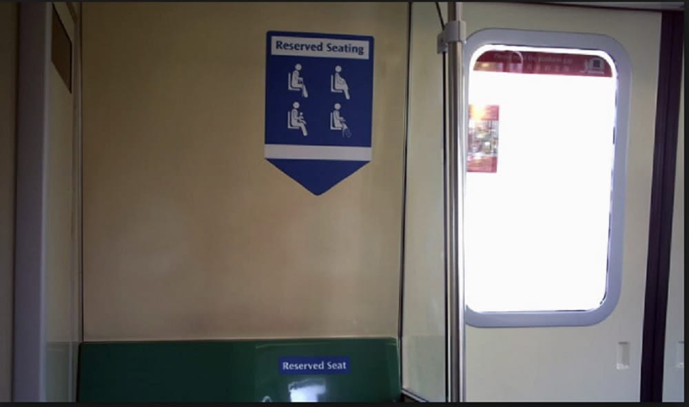  Woman sits on boy lap who refused to give seat in metro in Nanjing, China