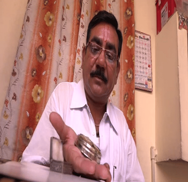 Is this the world's smallest quran, the Hindu family worship in the temple daily