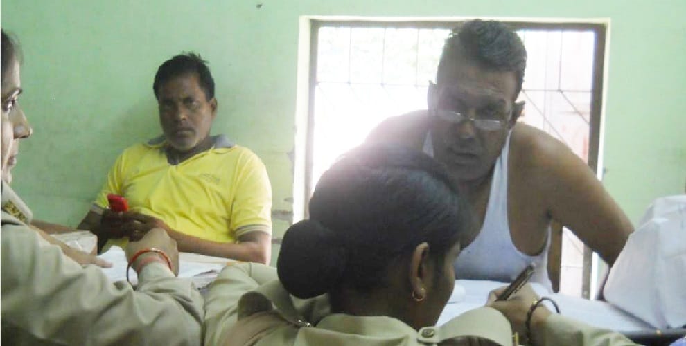 The police officer, who is not doing duty in uniform, take photographs...