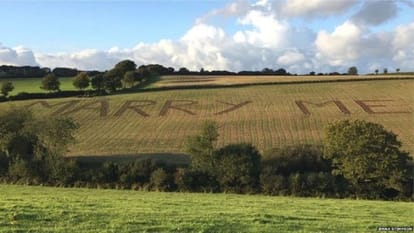 Man ploughs land and write Marry Me to propose girl