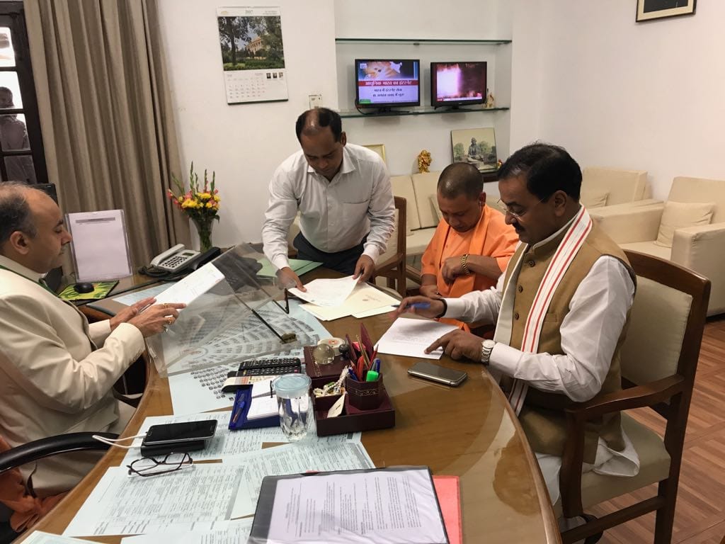 Cm yogi and deputy cm resign from members of parliament post