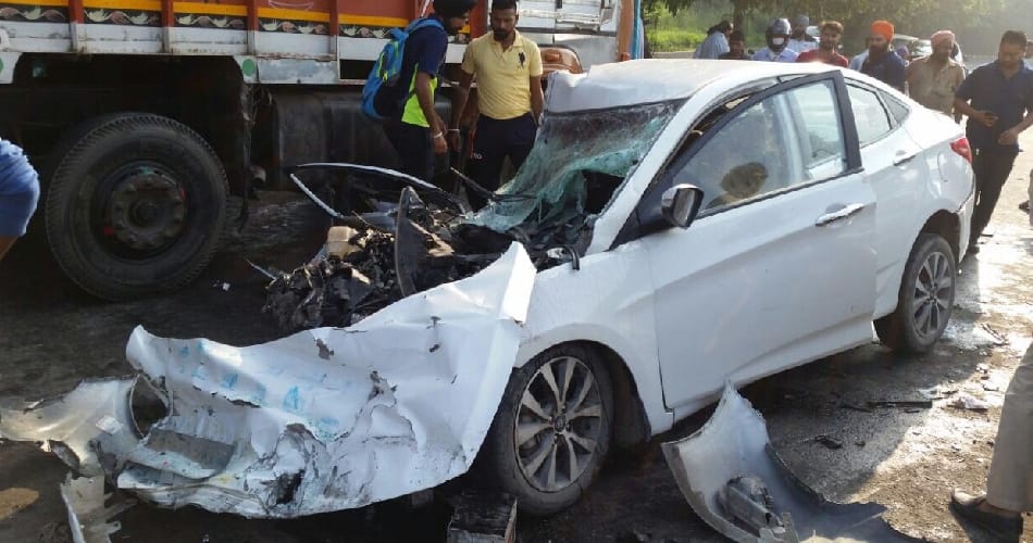 Man dies as car jumps divider, hits truck
