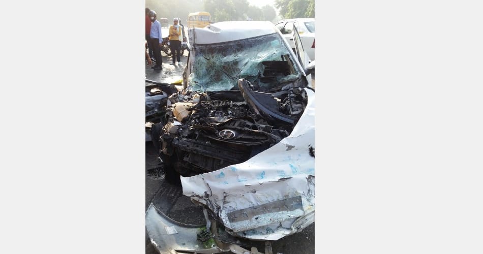 Man dies as car jumps divider, hits truck