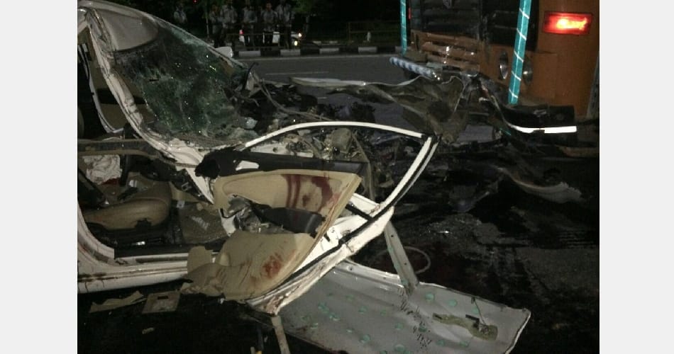 Man dies as car jumps divider, hits truck