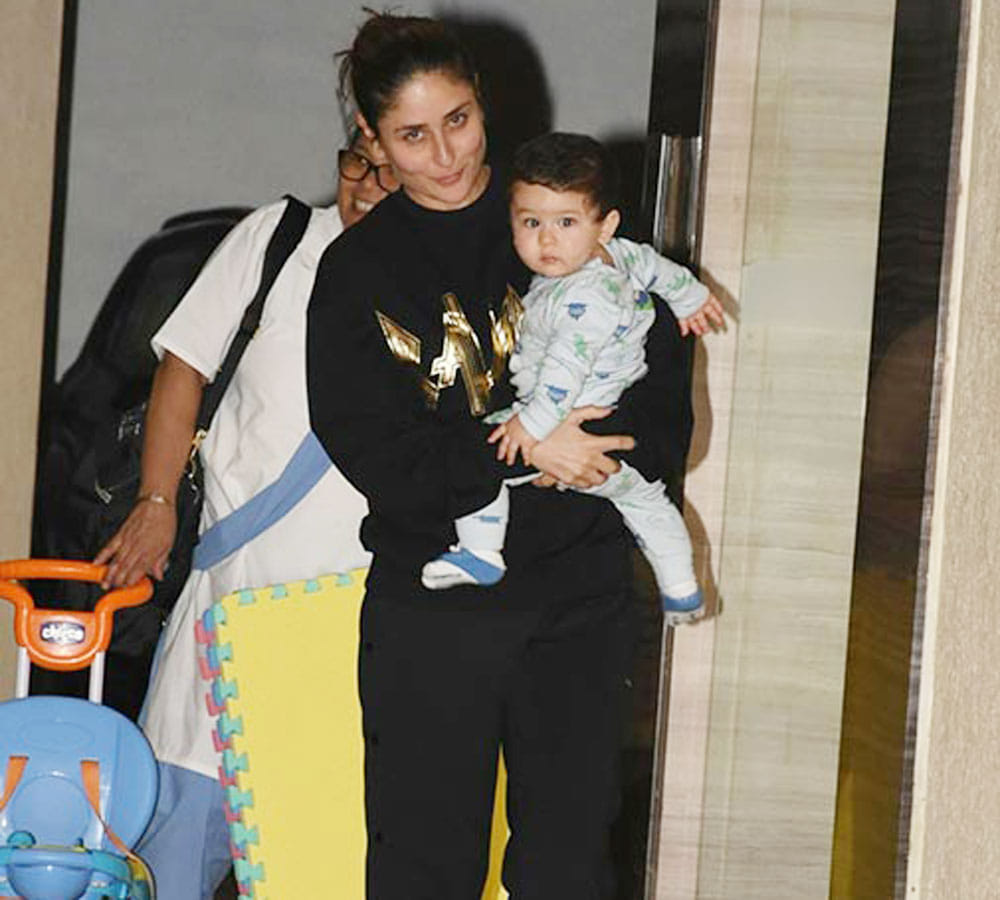 Taimur Ali Khan stare at Papa Saif ali khan picture with his nawabi swag
