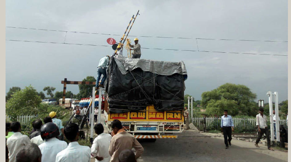 Truck reached on track by breaking barrier