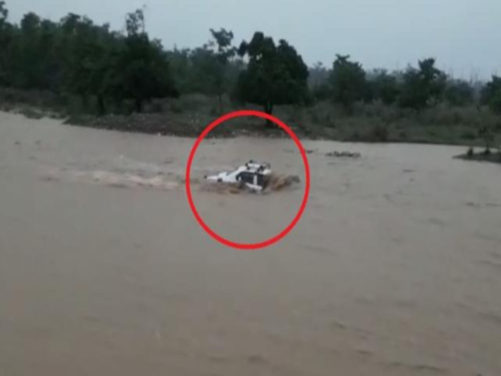 Car swept in heavy flow of river in haridwar