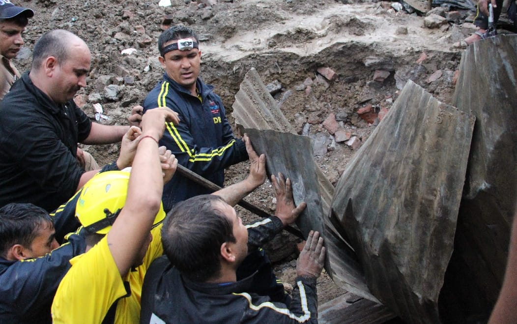 Father crying after see his sons situation during house collapse 