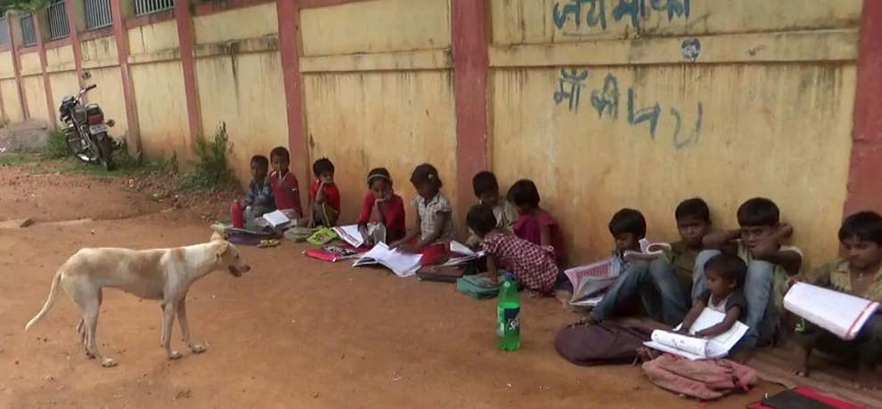 children force to study on muddy road in madhya pradesh because they do not have place for school