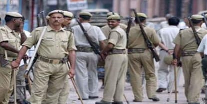 Standing in the police station, police defend the accused