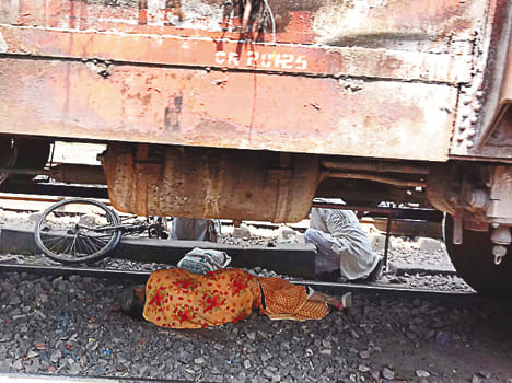 Lady lying under the train