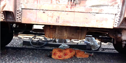 Lady lying under the train