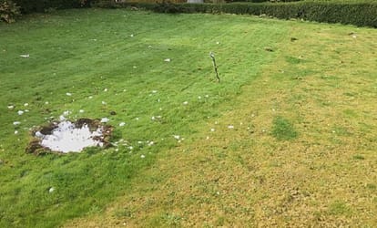 Family have lucky escape when huge ice ball falls from the sky