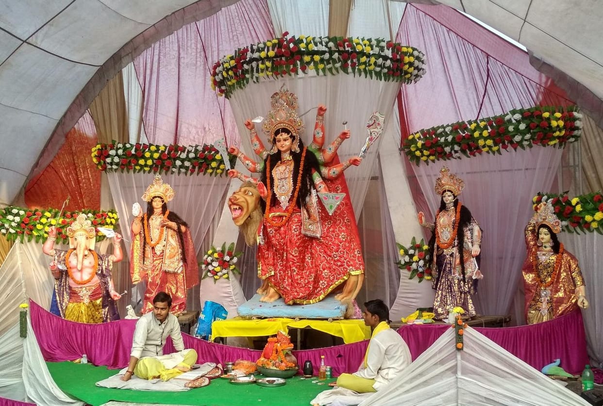 Somewhere nine Durga is where the mother is sitting with Ganesh