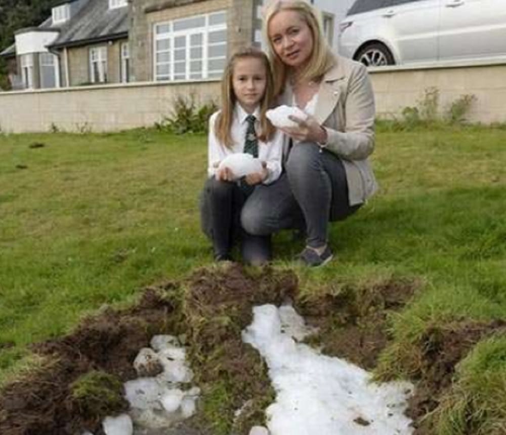 Family have lucky escape when huge ice ball falls from the sky