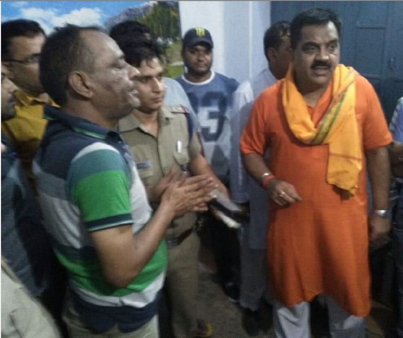 bjp mla beaten a youth in police station in rudrapur