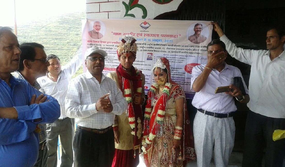 Bride and groom clean village with family before marriage