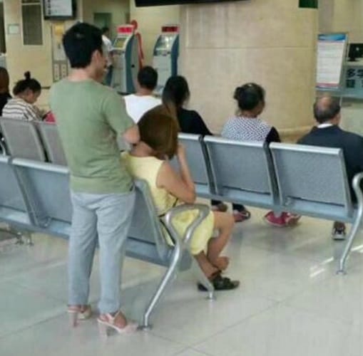 In china a man wear high heels to relieve her girlfriend tired feet