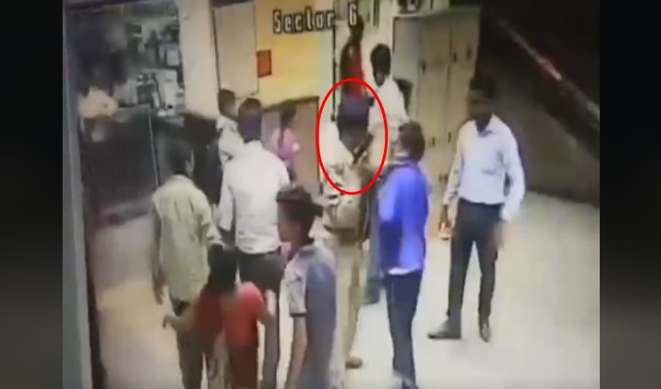 CISF officer fires in the air to disperse a group of people at Azadpur metro station