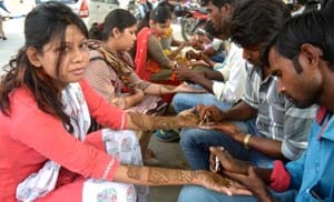 Hands-on-face, palms started with henna