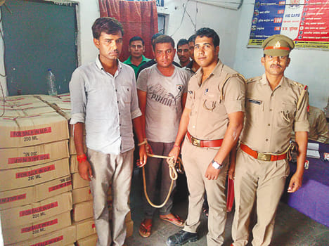 Seized 64 bags of fake liquor found in pick-up, two arrested