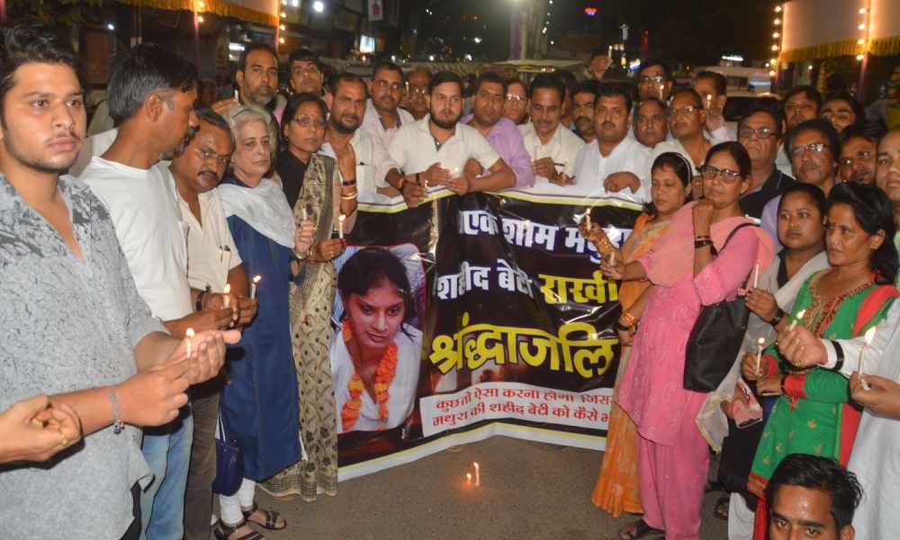 candle march after suicide of girl in mathura
