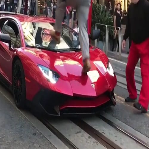 man jumps on three crore car video goes viral on internet 