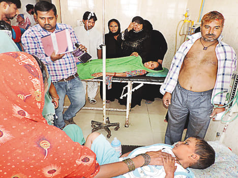 Four injured in bike rider from tractor collision