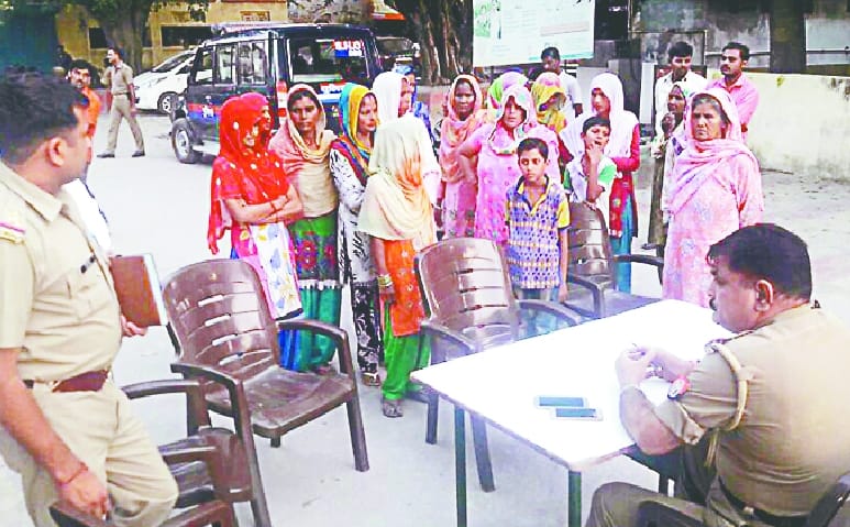 Women told in police station, shutdown of illegal liquor