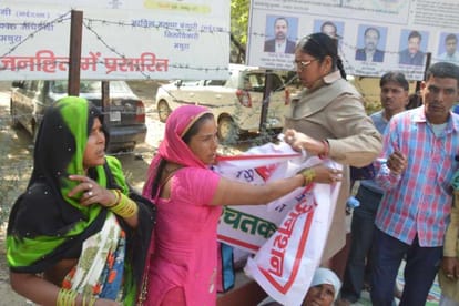 family protesting outside mathura dm office
