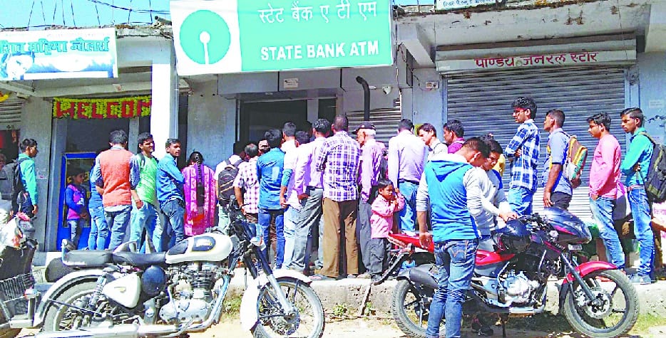 Long line looking forward to ATM in Bediag