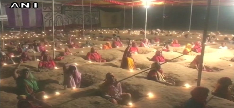 Farmers celebrated Diwali with protesting by burying themselves partially in pits  