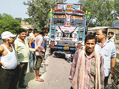 Bike driver injured in truck collision