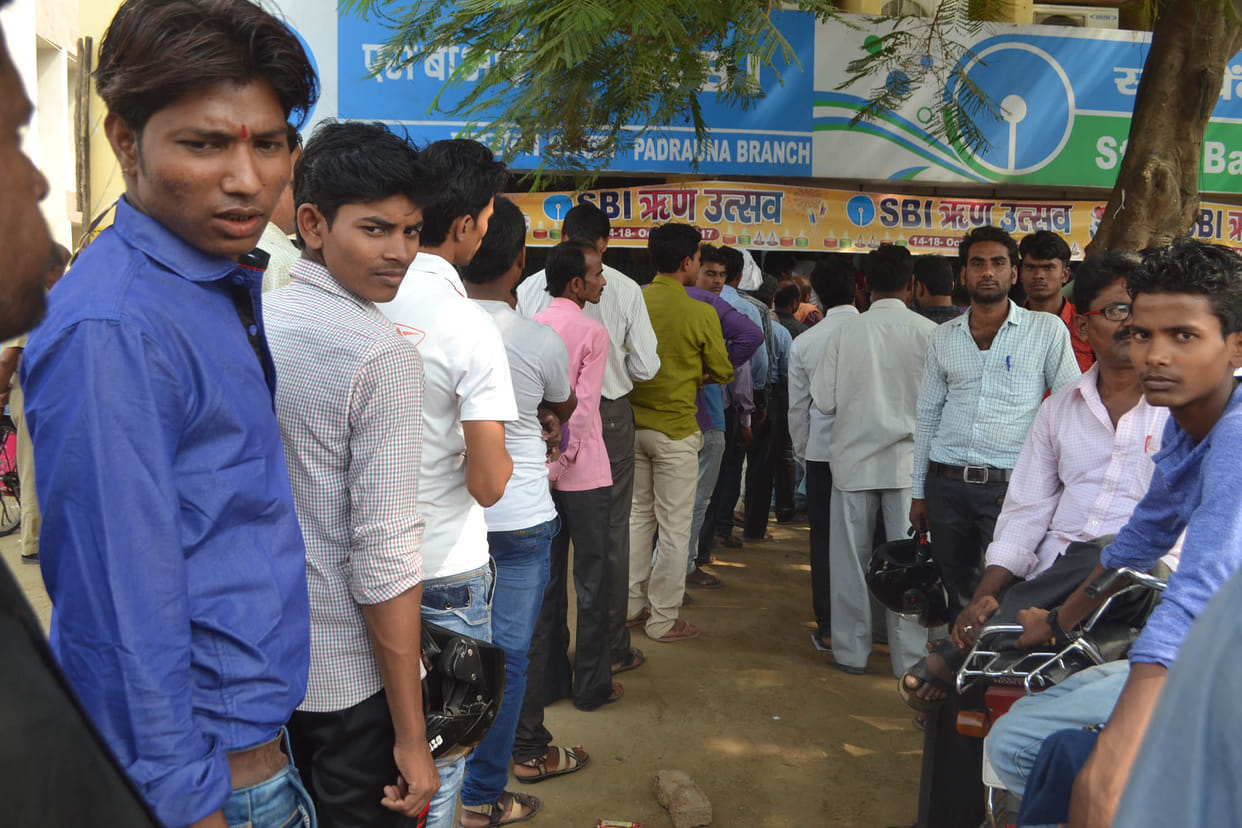  Long line of customers on bank and ATM.