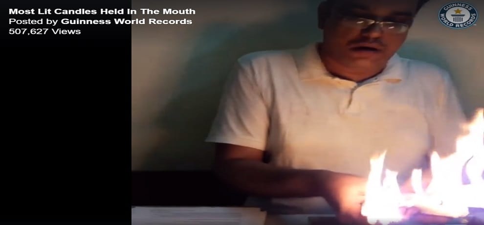 mumbai man made world record for holding twenty two lit candles in mouth