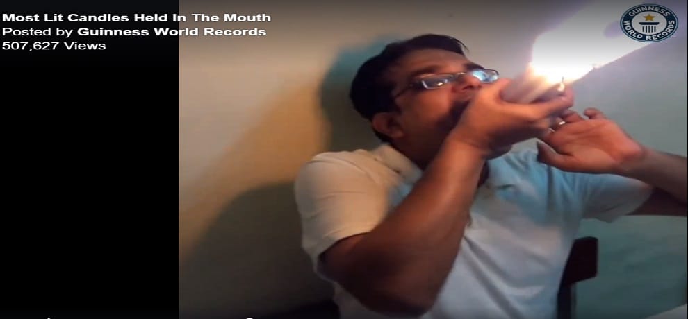 mumbai man made world record for holding twenty two lit candles in mouth