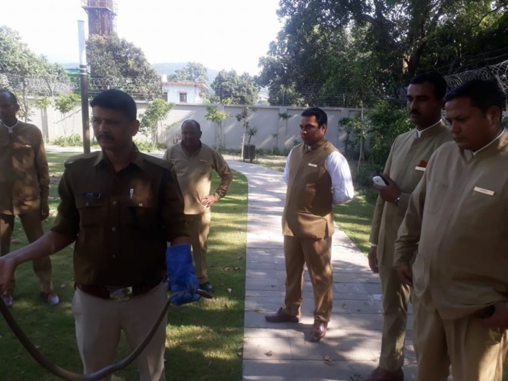 snake stuck in electric fencing of dehradun resort