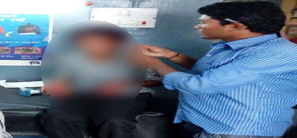 a teacher beating student in school at allahabad of uttar pradesh