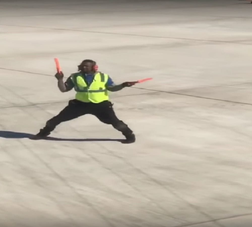 airport worker spotted dancing during Boarding Process video being viral