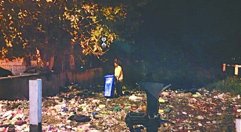 Medical waste throws at night to hide the hospital