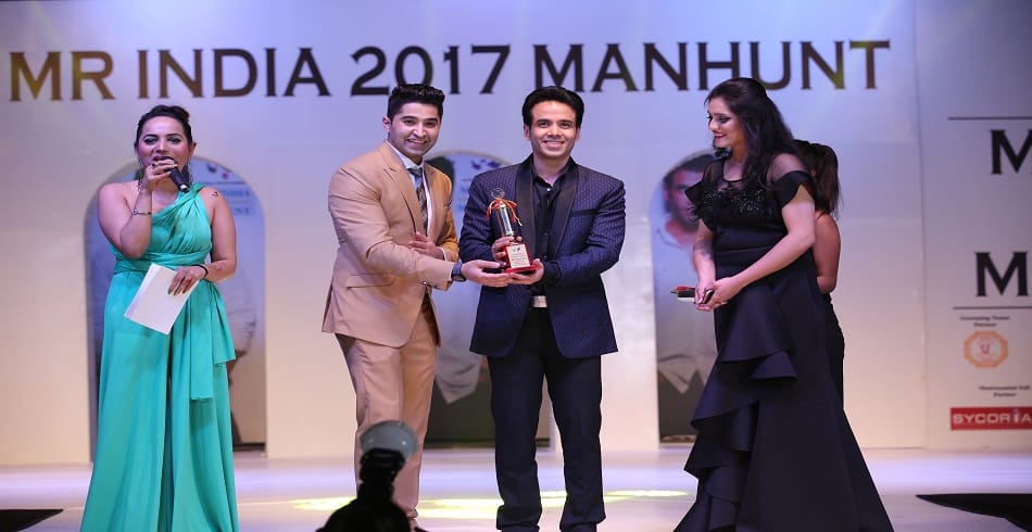 Delhi boy Gaurang Arora wins the Mr India Manhunt 2017 title Tusshar Kapoor gives the trophy 