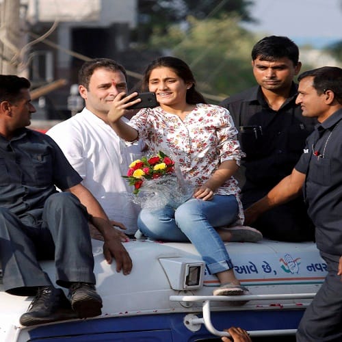 girl climbed rahul gandhis van for selfie in bharuch rally 