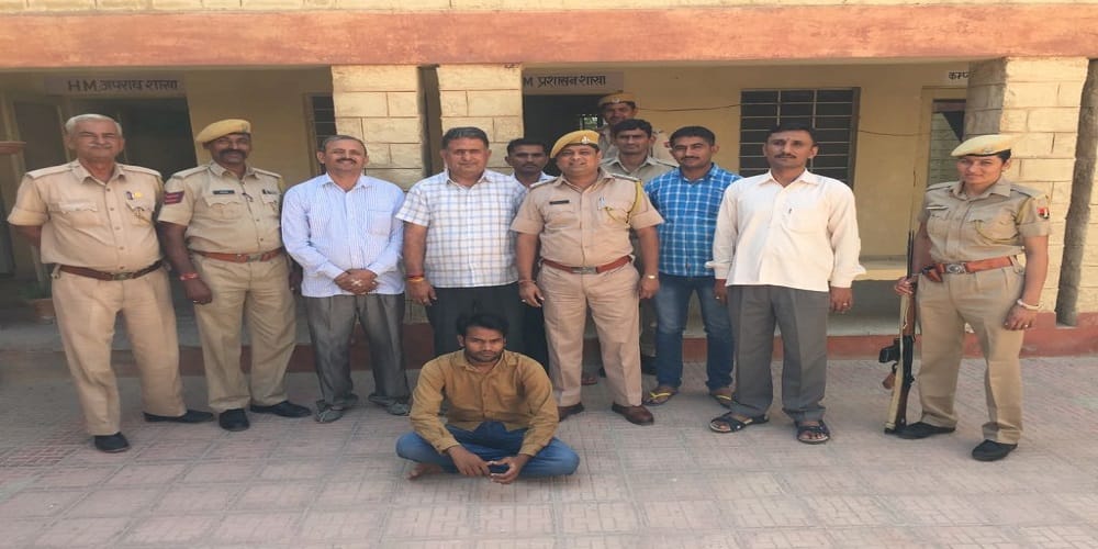 a man arrested by police in online fraud case