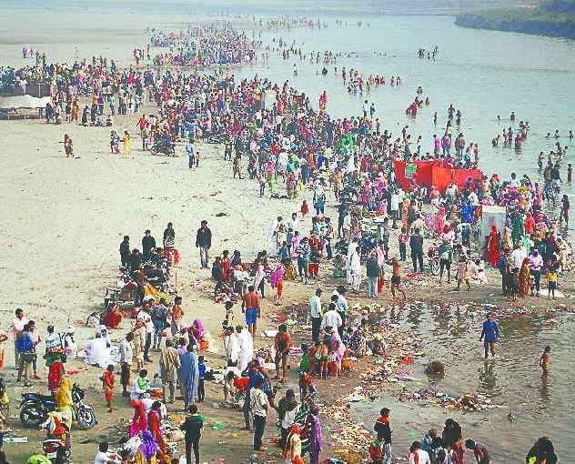 Earning money by putting a dip in Yamuna