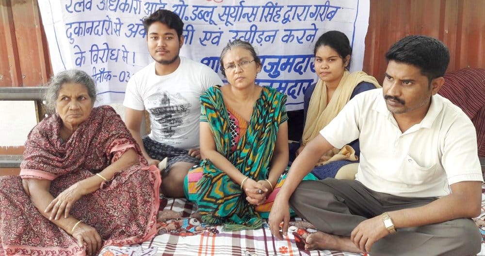 The woman sitting on the right side of action