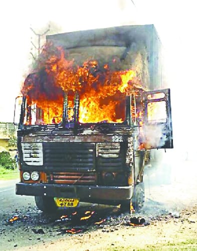 ... and burns to the light truck