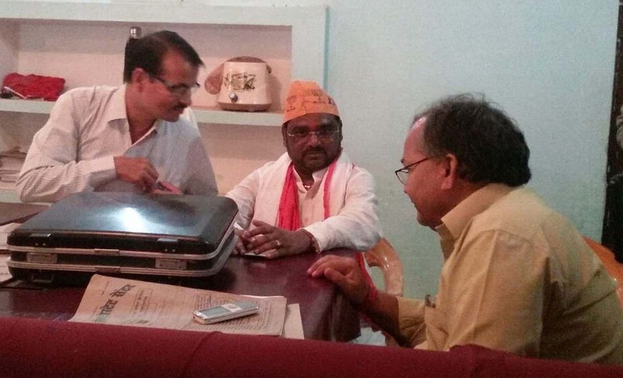 MP sit on the chair with election officer in sonebhadra