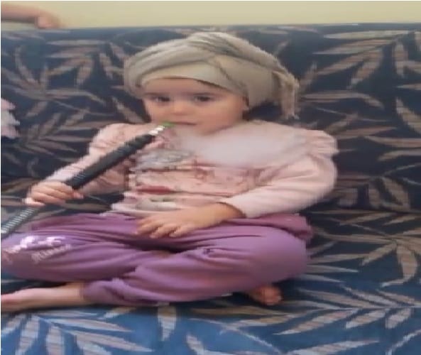 little girl has such a hobby to drink hookah in haryana style